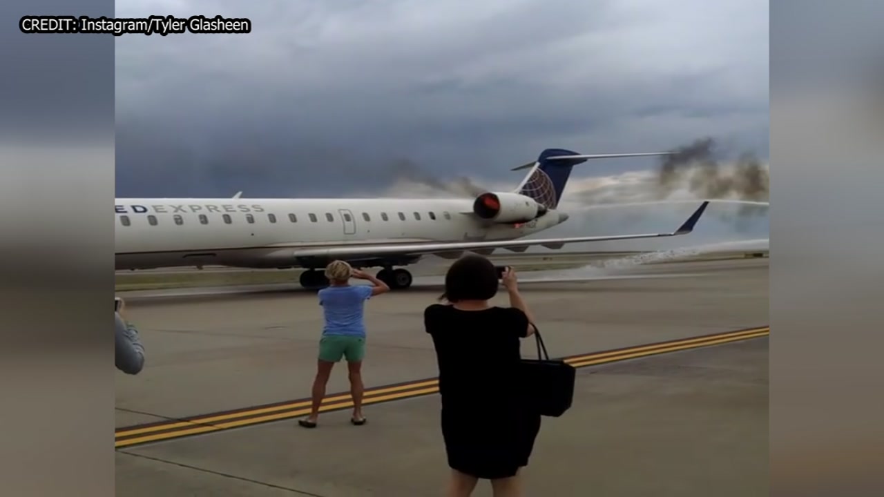 Engine catches fire after United plane lands in Denver