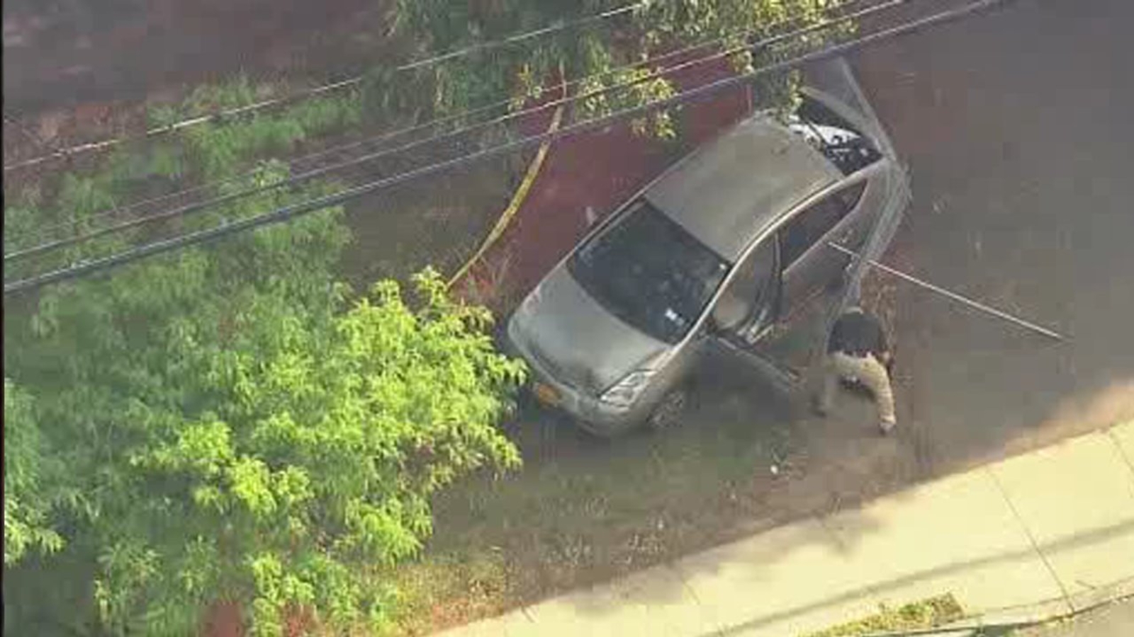 Livery driver injured after apparent shooting, crash in Spring Valley