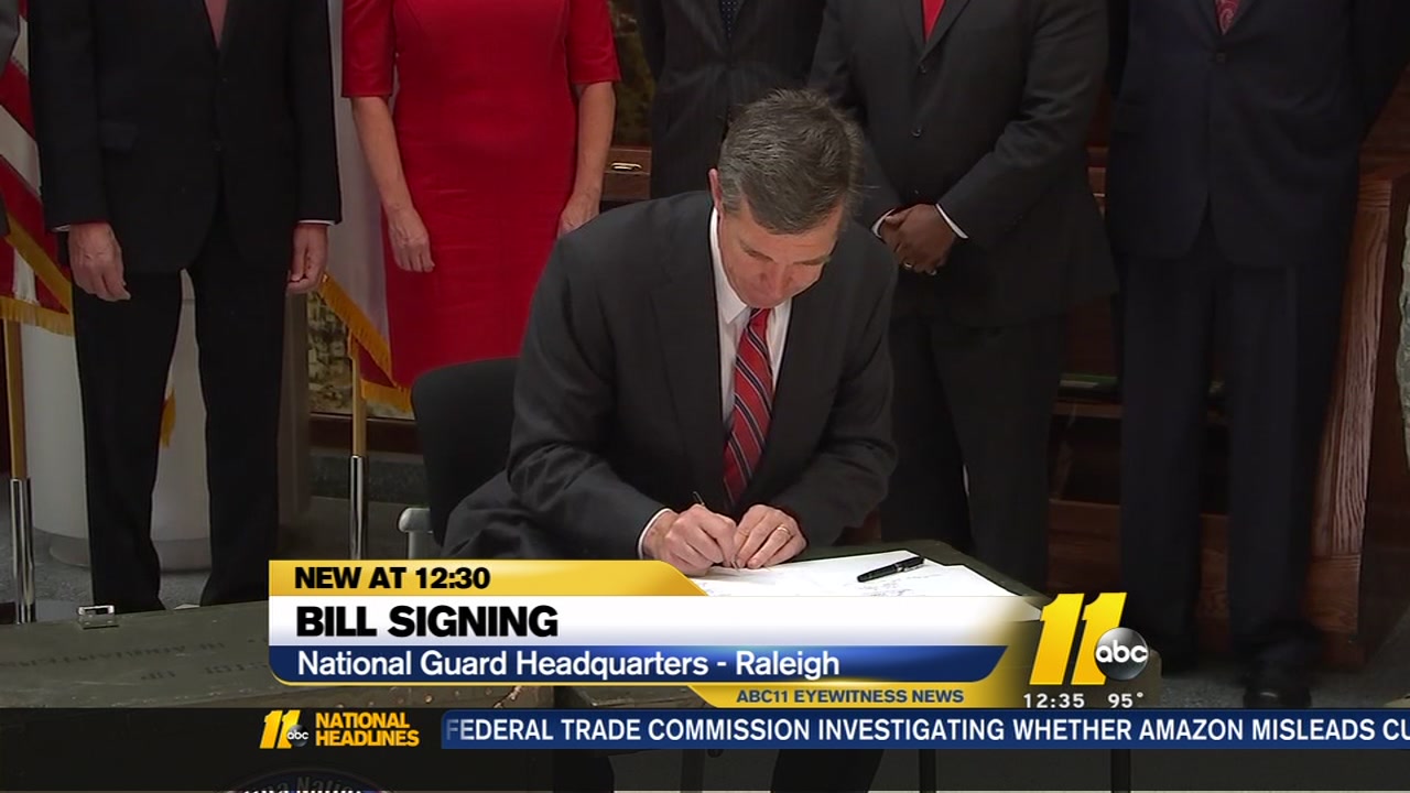 Gov. Roy Cooper signs National Guard bills