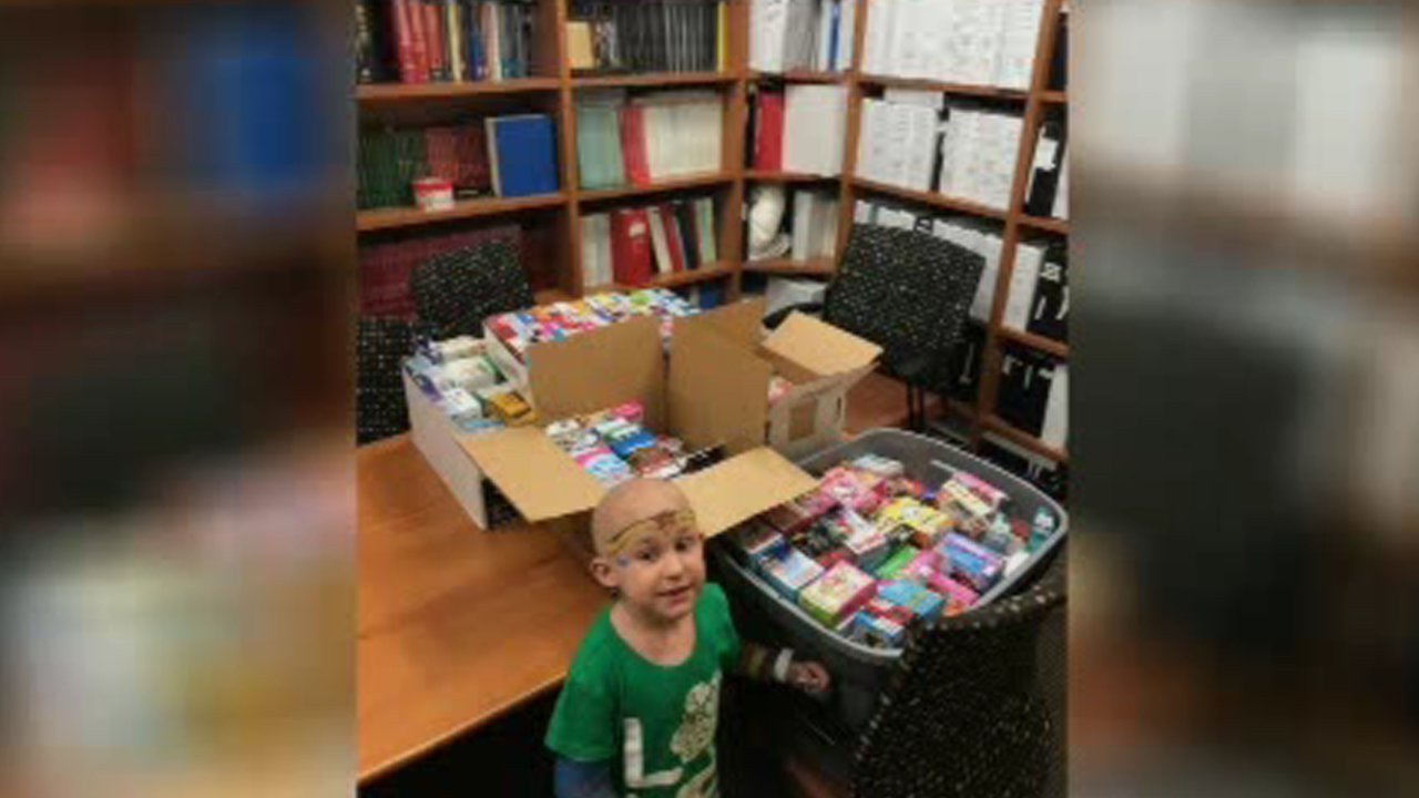 Young survivor donating Band-Aids to help child cancer patients