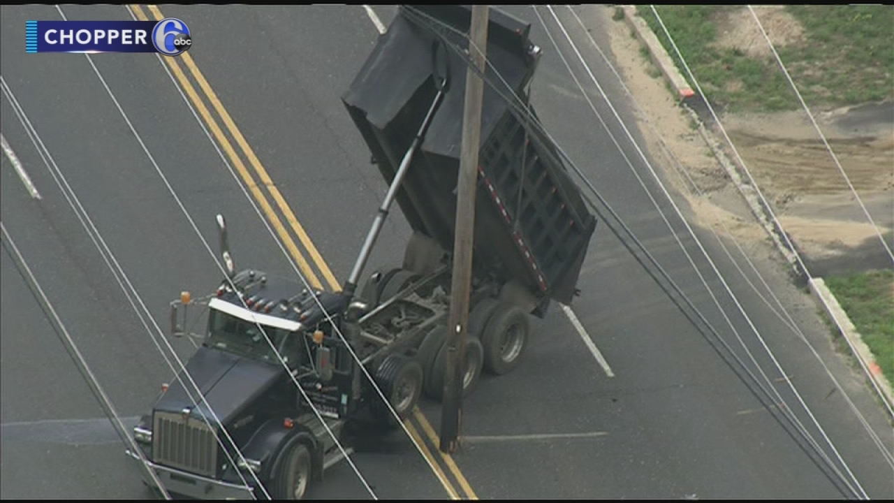 Dump truck hits wires, brings down utility pole in Voorhees, N.J ...