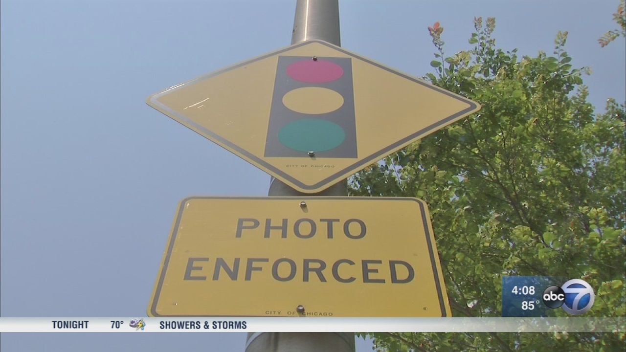 City Council approves red-light, speed camera settlement