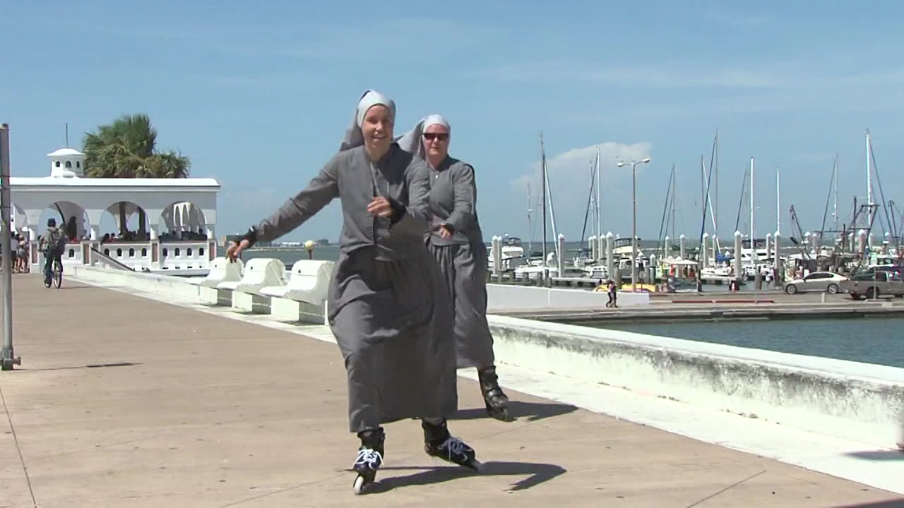 Corpus Christi nuns Rollerblade in full wardrobe