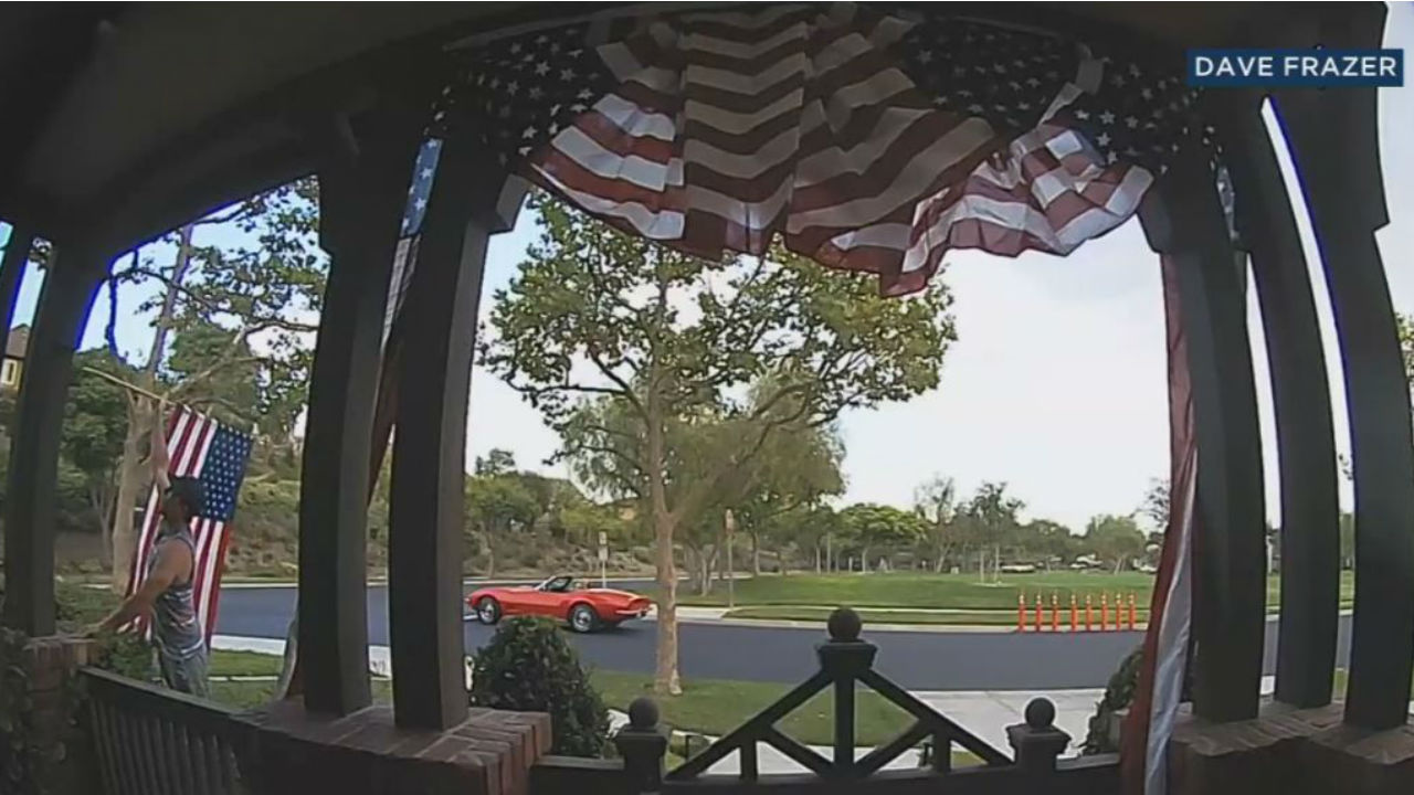 Video shows man putting up fallen American flag at OC home