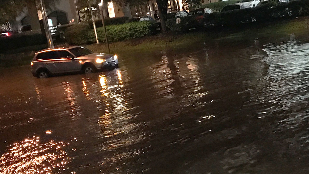 People climbing into their attics to escape floodwaters