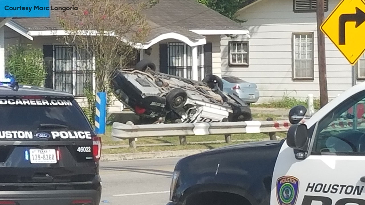 HPD officer taken to hospital after crashing into house