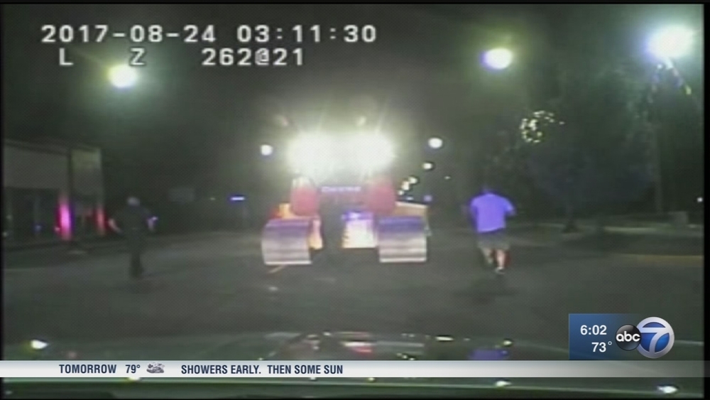Bulldozer Gone Wild: Police car squished during chase 