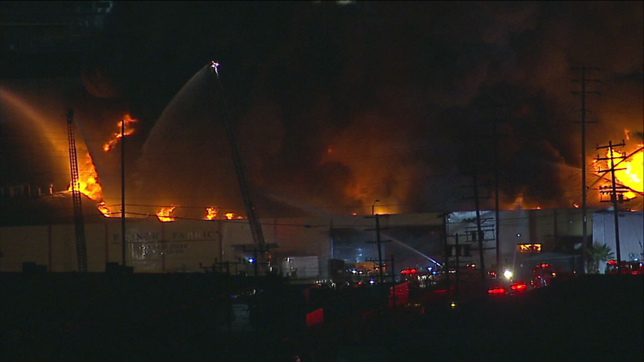 Firefighters battled a large blaze inside a fabric warehouse in Boyle Heights on Saturday, Oct. 14, 2017.