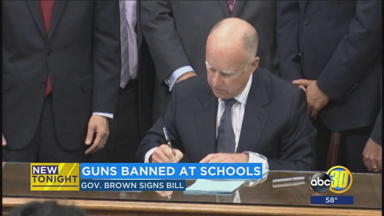 Gov. Brown signs new bill banning all guns on school campuses