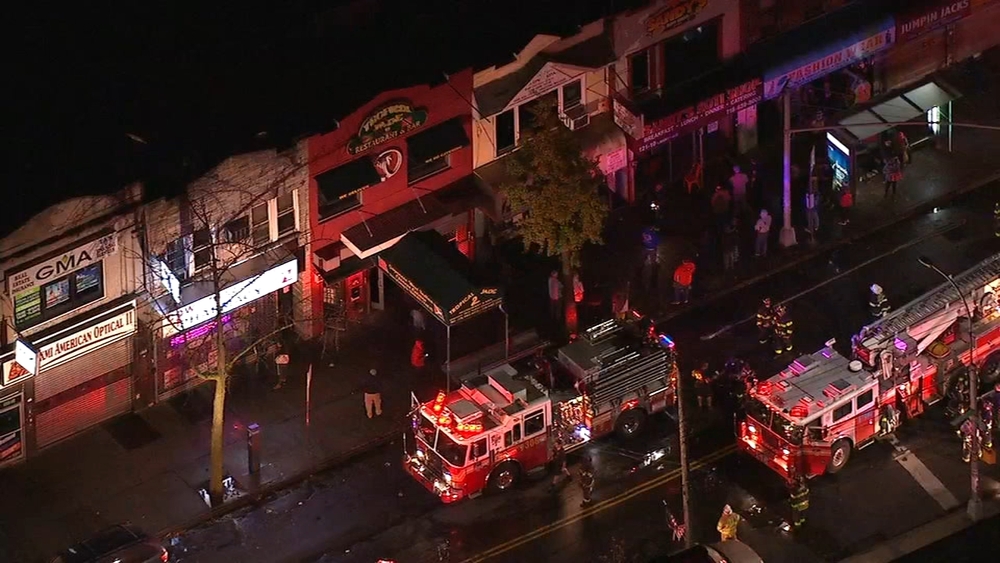 Fire burns through businesses in Queens