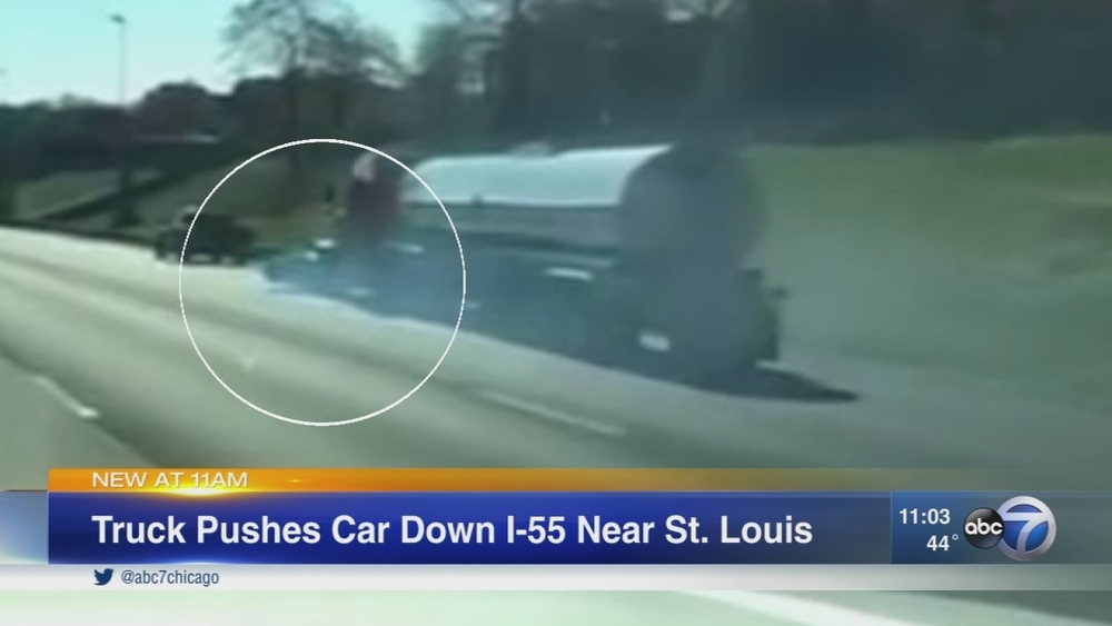 Semi pushes car down I-55