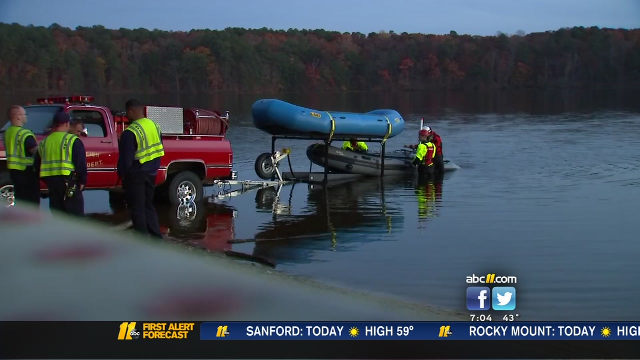 Authorities work to pull body out of Lake Johnson in Raleigh.
