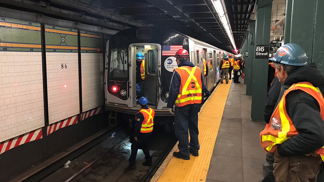 Subway service disrupted when portion of wall falls onto track, platform in Brooklyn