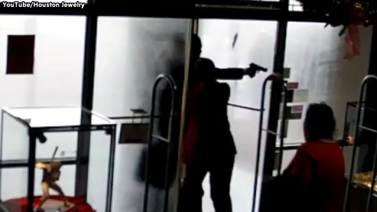 Grandmother pushes robber out of jewelry store as he opens fire
