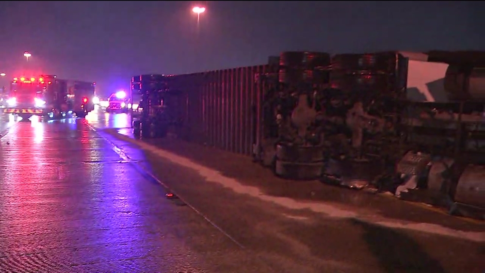 Big rig rolls over on car