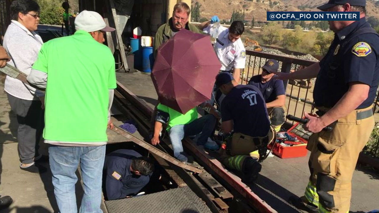 OC car wash worker stuck in guide rail