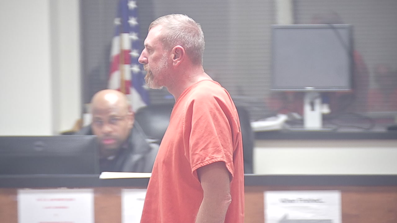 Man arrested with multiple weapons in his hotel room appears in court.