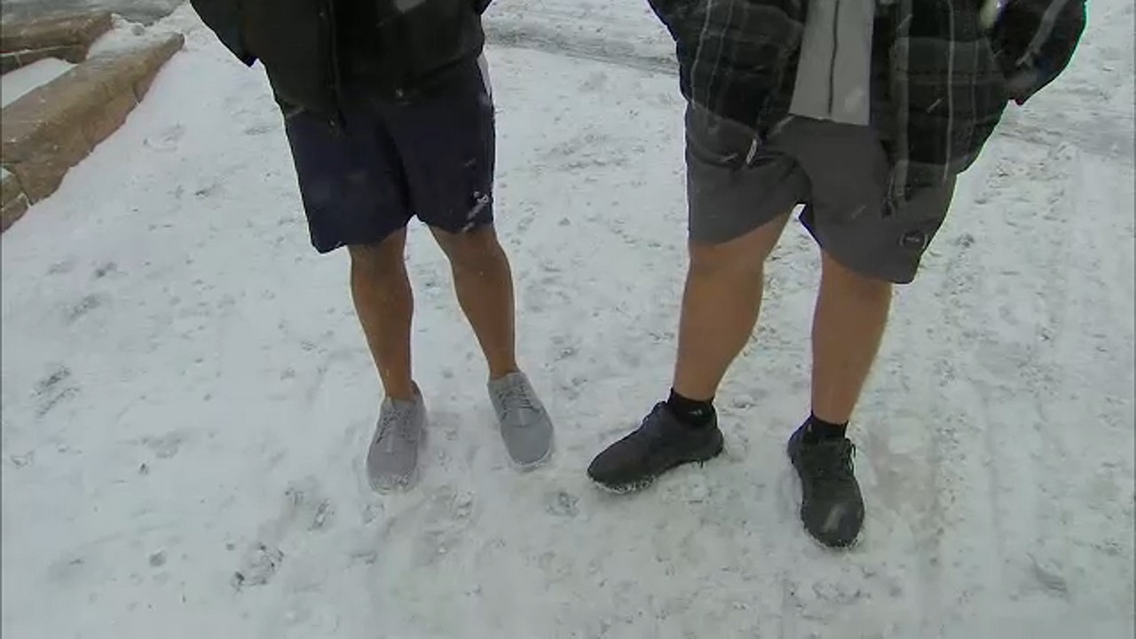 Snow and men in shorts in White Plains