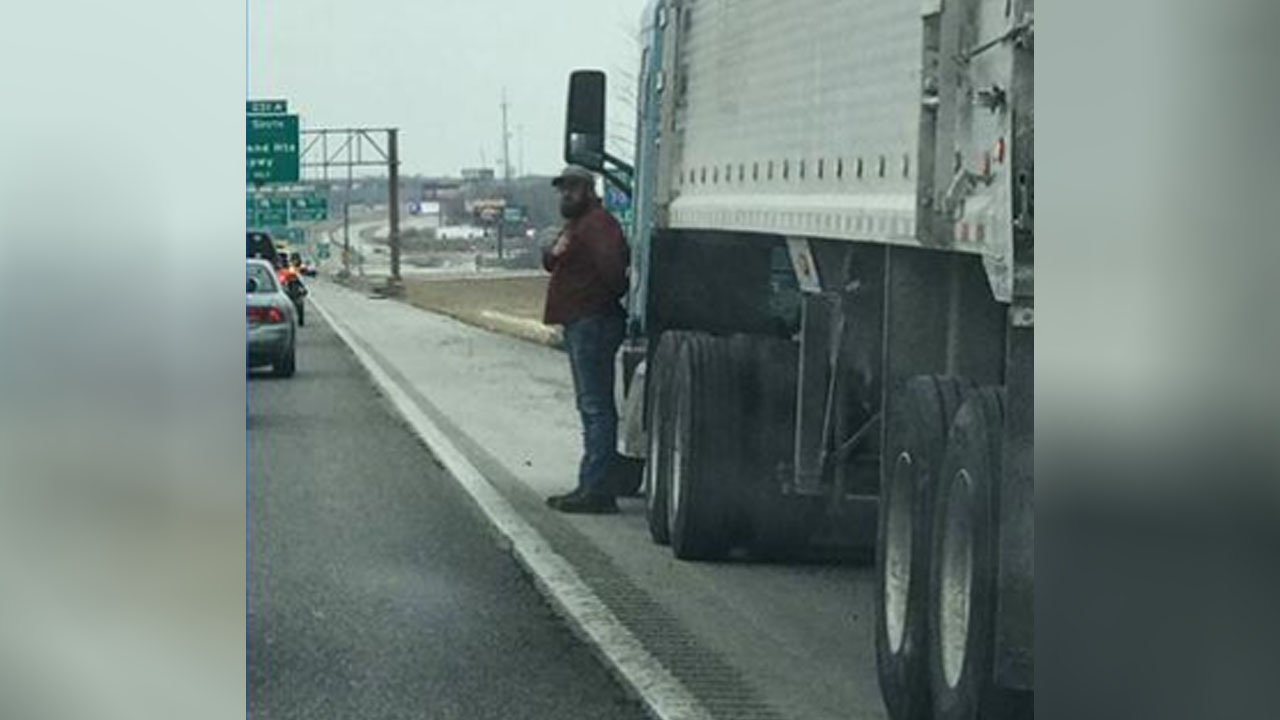 Truck driver salutes funeral procession