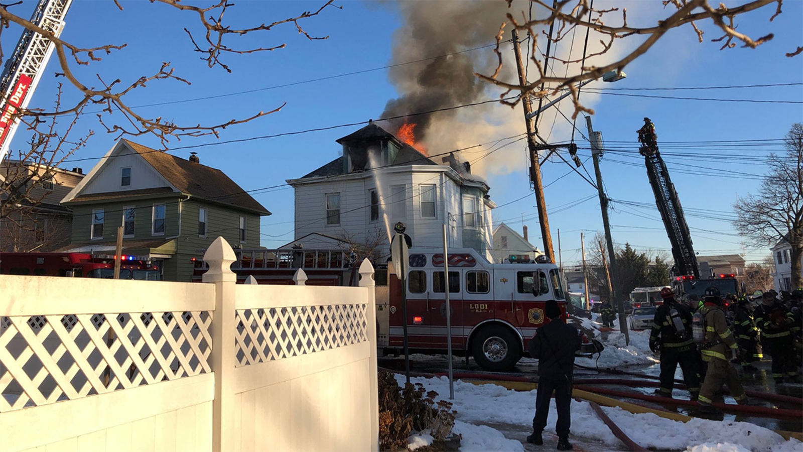 Woman rescued from 2nd floor after fire tears through New Jersey home