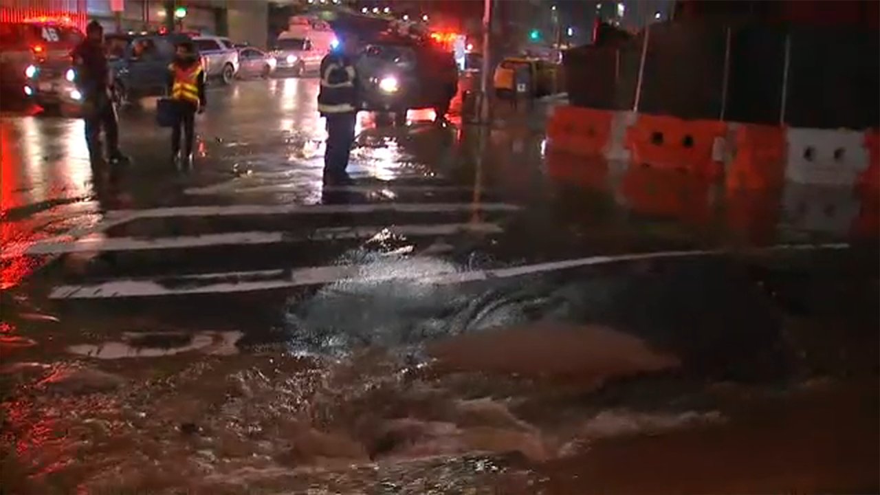 Water main break in Jackson Heights floods intersection
