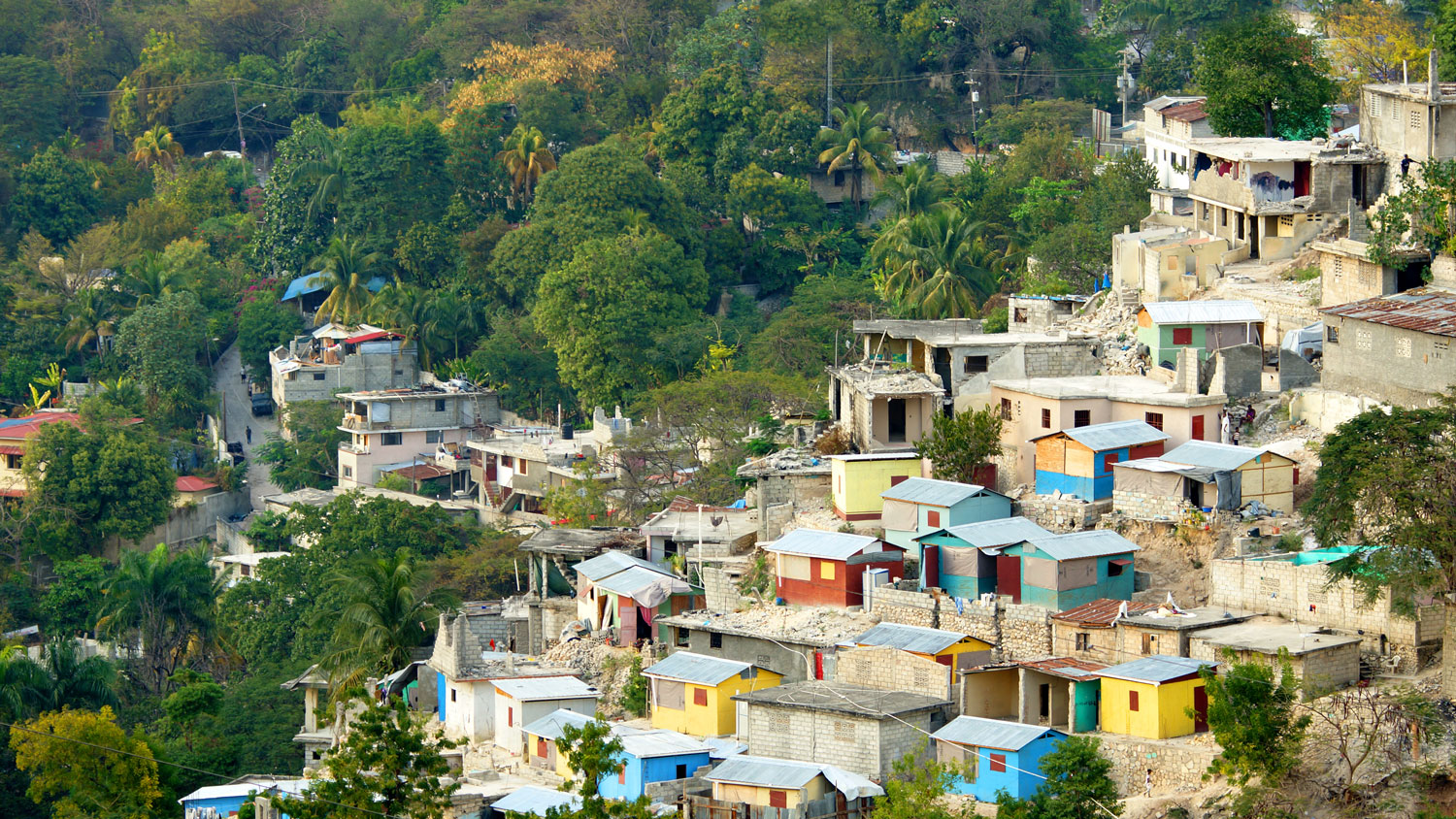 Buildings sit on a hill in a rural town of Haiti.