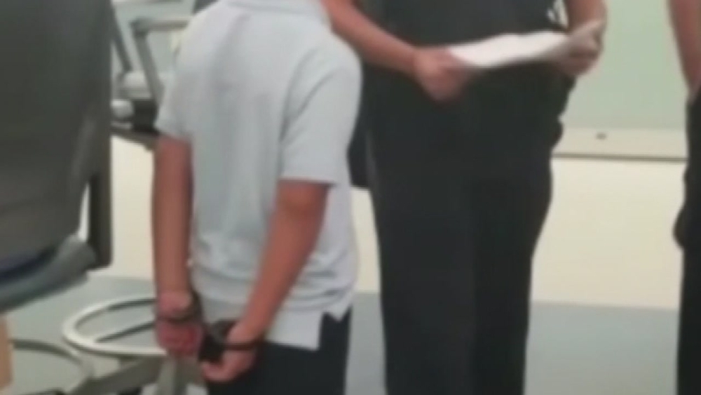 Child handcuffed