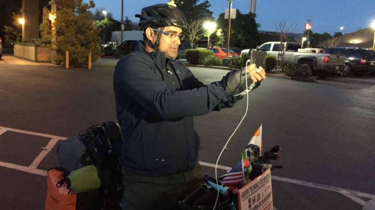 Man riding bike around the world for climate action stops in Bay Area
