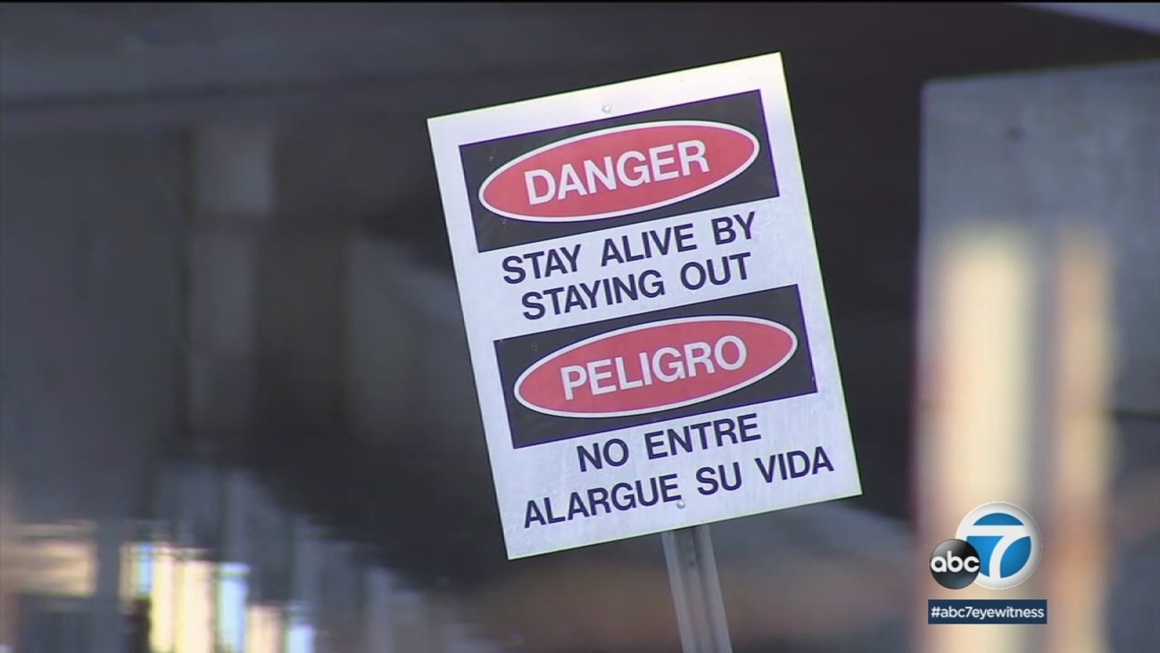 Warning signs are posted in the California Aqueduct in Hesperia.