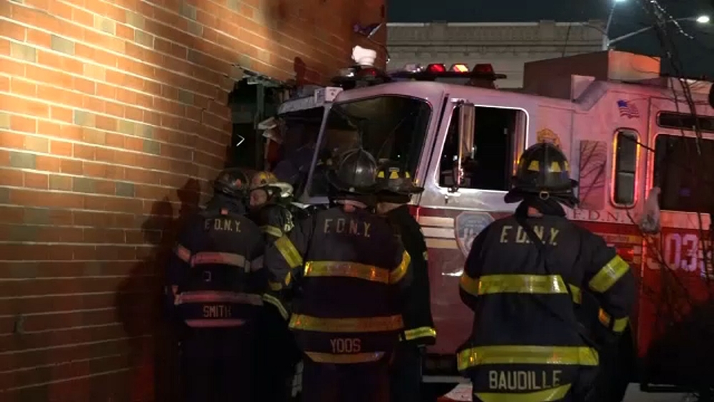 FDNY truck punches hole in side of Queens building