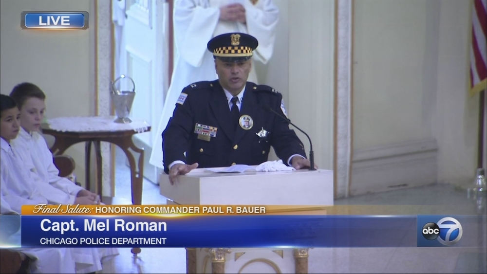 Capt. Mel Roman speaks at Cmdr. Bauer's funeral