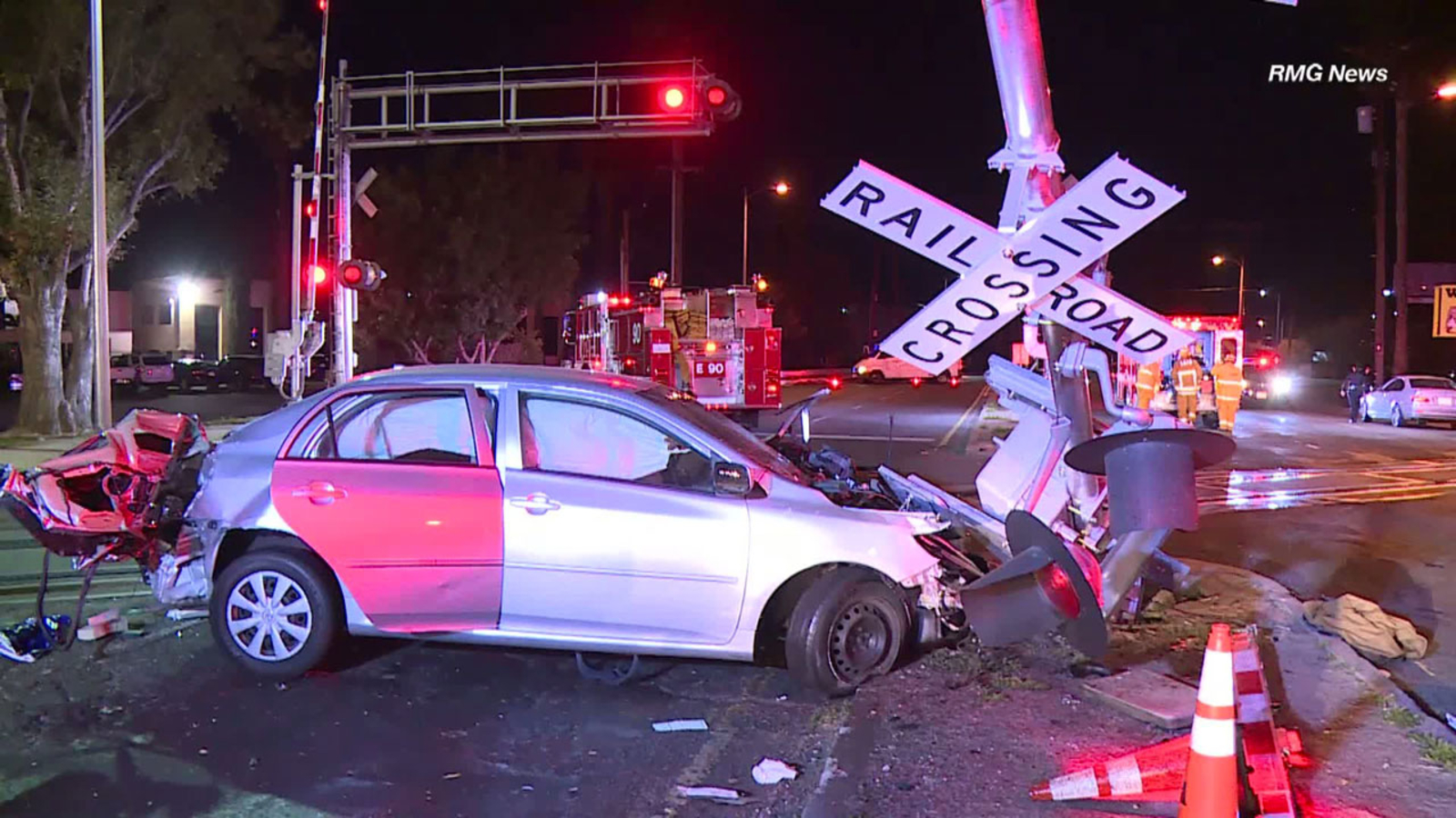 Good Samaritans pull woman from car moments before train crashes into ...