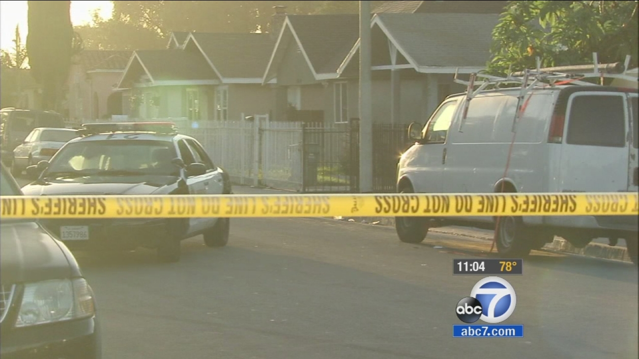 Authorities investigate a fatal stabbing in the Florence-Firestone area on Thursday, Sept. 18, 2014.