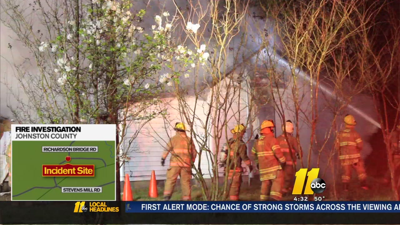 Fire crews battle a house fire in Johnston County
