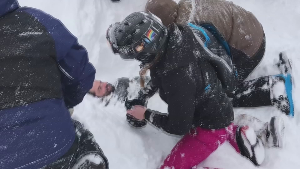 People rescue man buried alive in snow after avalanche