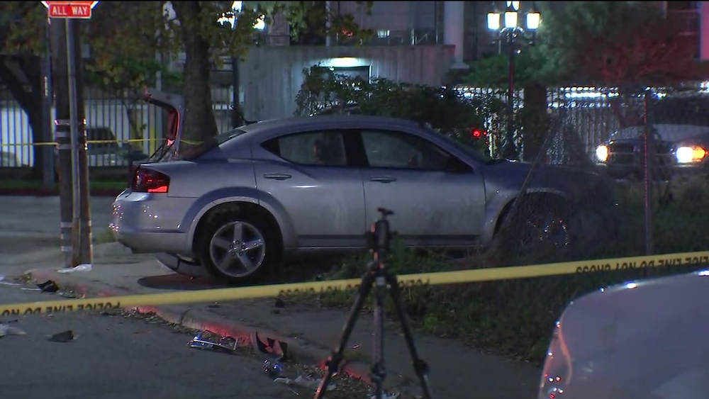 Car hits people bar