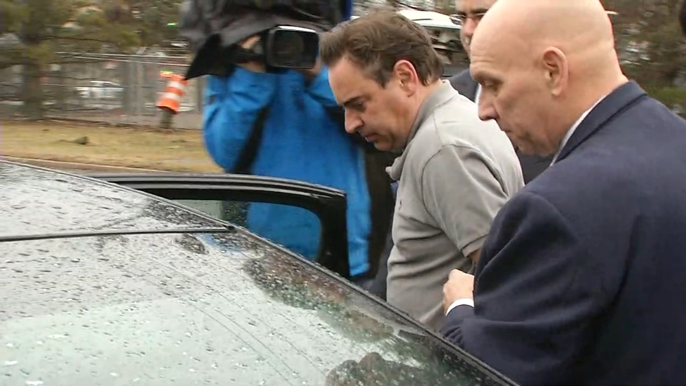 Suffolk County Judge Robert Cicale walked by police