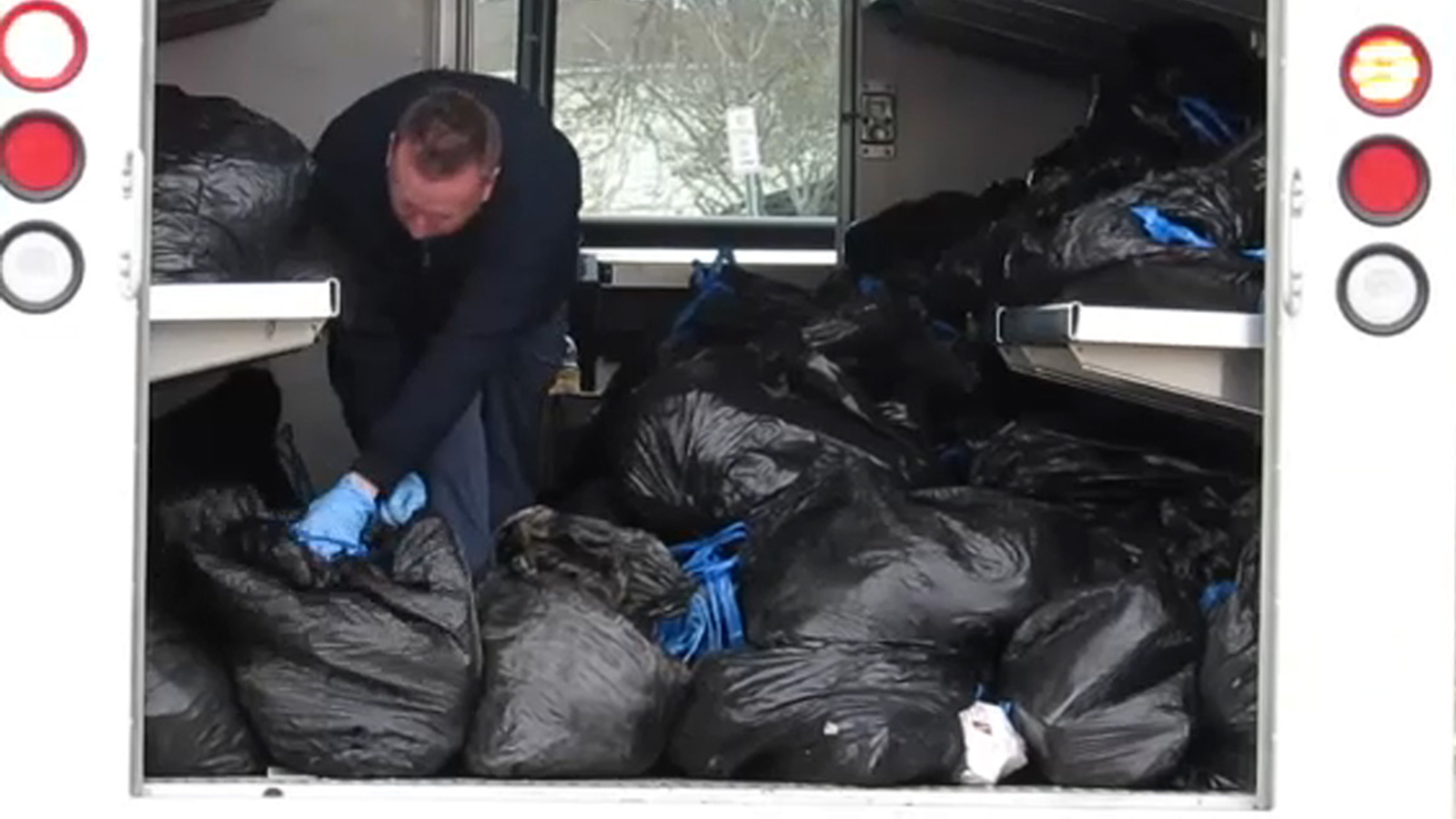 Dozens of bags of undelivered mail found in postal worker's backyard