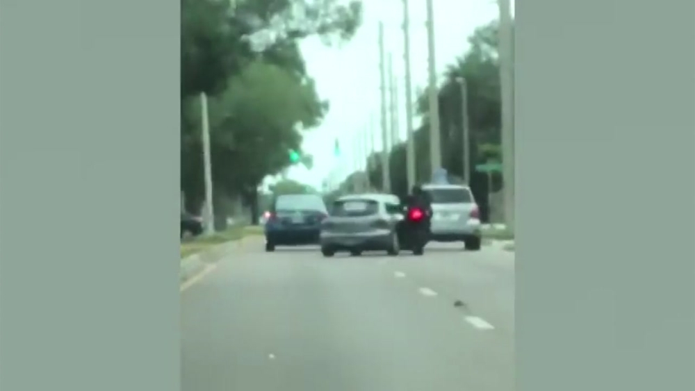 Police searching for driver of car that slammed into motorcycle