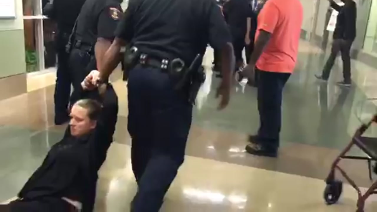At least one person dragged out of tense HISD board of trustees meeting