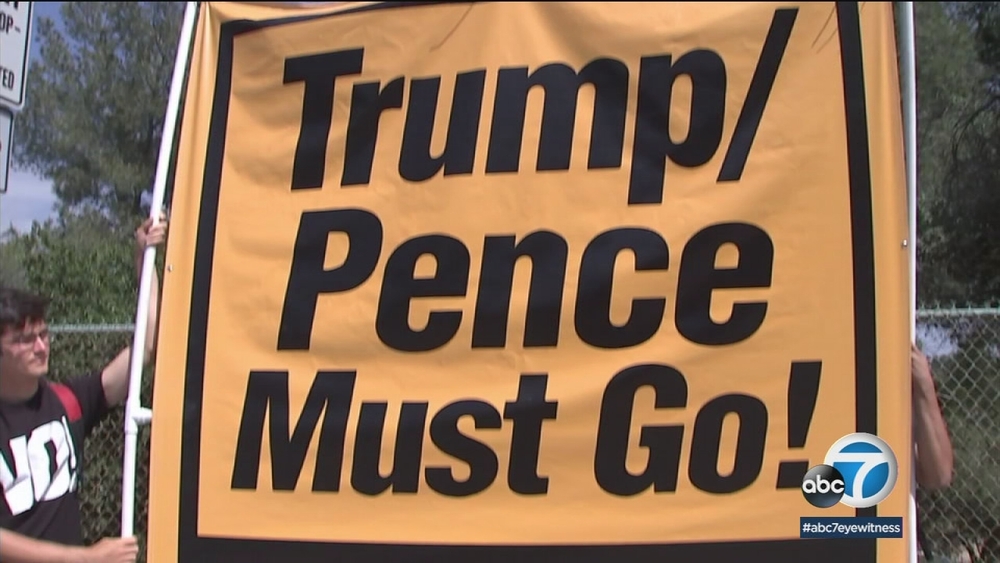 Pence greeted with protests during visit to JPL in Pasadena