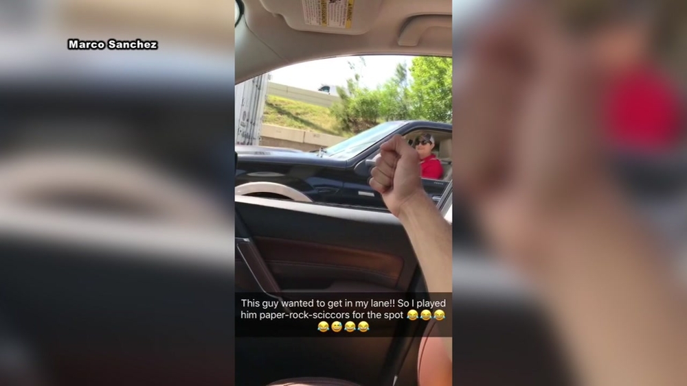 A game of rock, paper scissors during Houston traffic