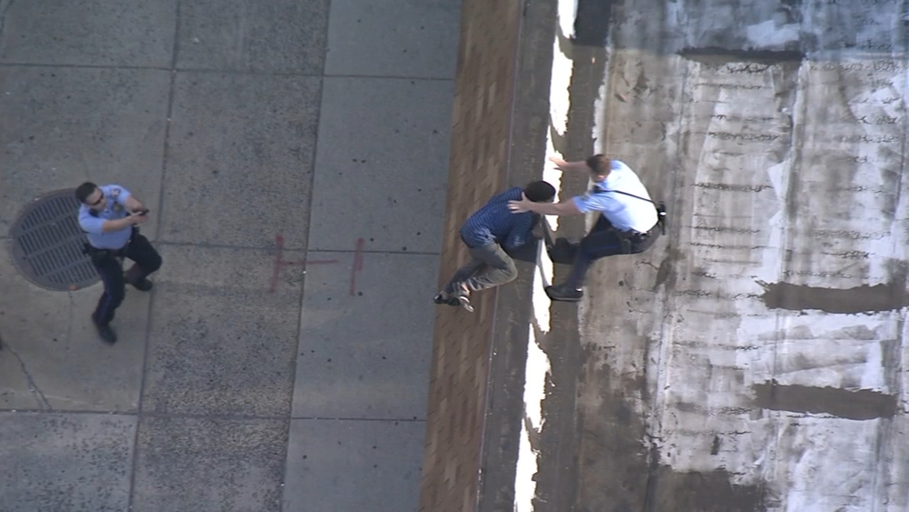 Police car chase ends in rooftop arrest