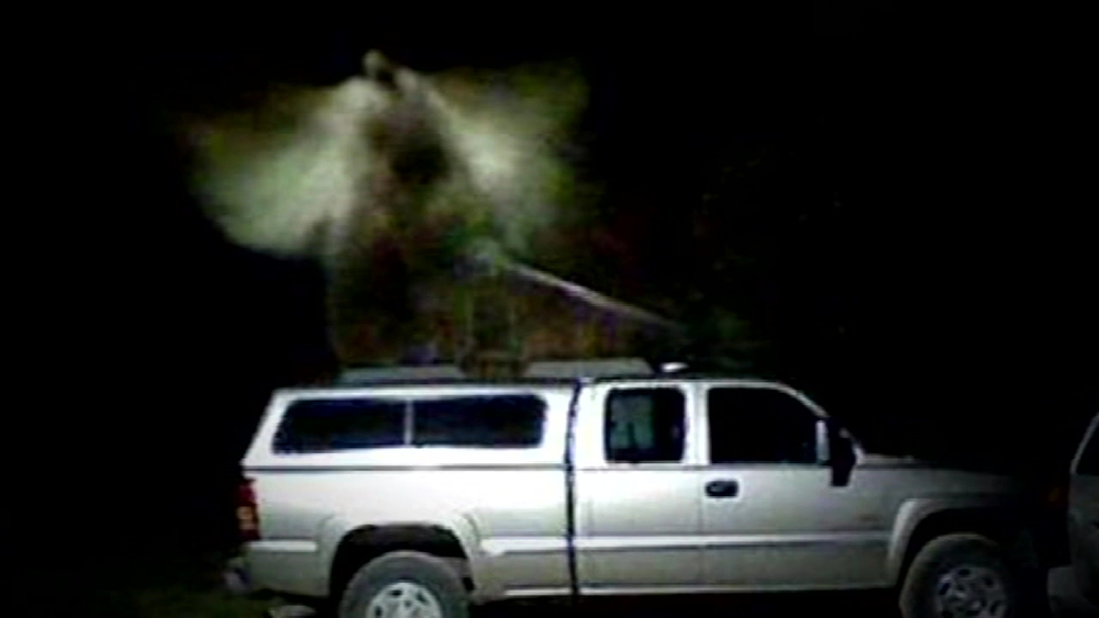 Security camera captures an angel hovering above truck