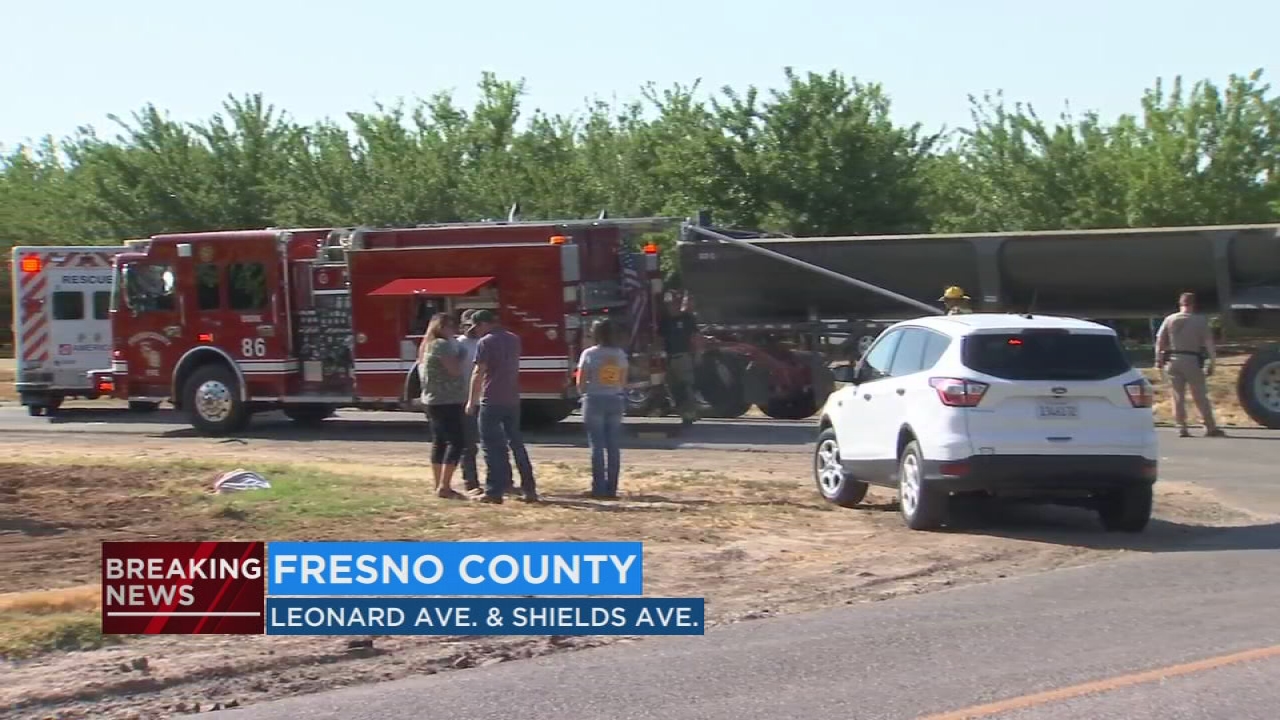 Two dead after sedan and semi-truck collide