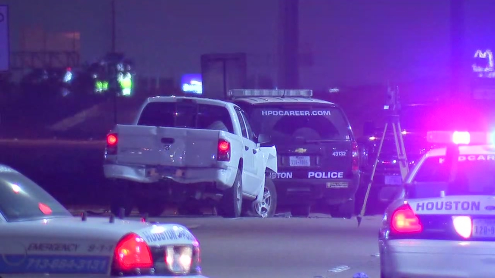 Houston police officer injured after patrol car struck from behind ...