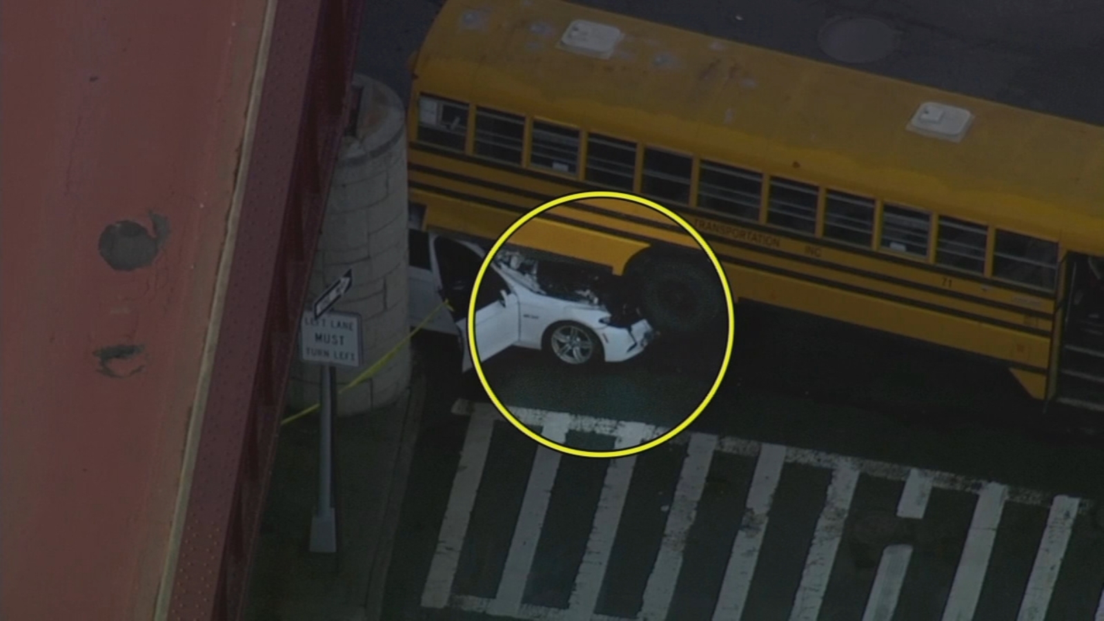 Chain reaction crash shoves car under school bus in Woodhaven, Queens