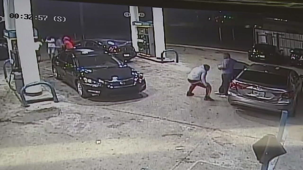 Surveillance feed of drive-by shooting that left four men injured