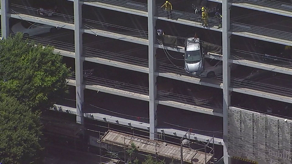 Car safely hoisted after hanging off Santa Monica parking structure