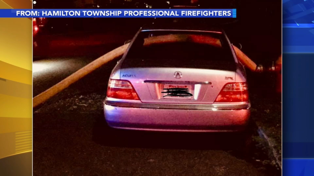 Firefighters break windows on car parked in front of hydrant
